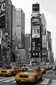 black and white photograph of taxi cabs in new york city