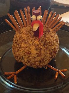 a turkey made out of oatmeal sitting on top of a glass plate