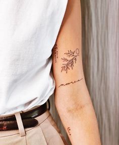 a woman's arm with a tattoo on it that says love and is written in cursive writing