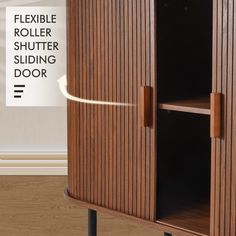 a wooden cabinet sitting on top of a hard wood floor next to a white sign that says flexible roller shutter sliding door