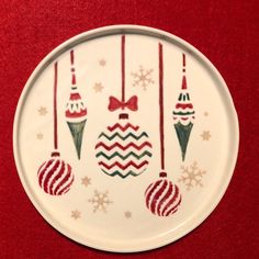 a white plate with christmas ornaments on it