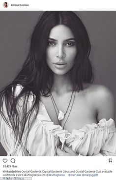 a woman with long hair wearing a white shirt and posing for a magazine cover photo