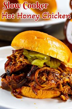 slow cooker bbq honey chicken sandwich on a white plate