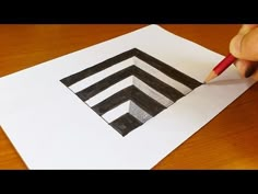 someone is drawing an image with pencils on paper that has been folded in the shape of a rectangle