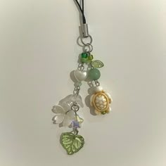 Aesthetic and lightweight, this phone charm is the perfect accessory to personalize your phone! -Length of beaded charm = 3in -Length of entire phone charm = 5in -Each phone charm is handmade and may look slightly different from listing photos -Includes one phone charm -Handmade with love <3 -Please contact me with any questions! Cheap Green Charms As Gift, Charm Keychain Aesthetic, Phone Charms Diy, Nature Coquette, Beaded Keychain Ideas, Phone Charms Ideas, Phone Charms Aesthetic, Car Mirror Charms, Mirror Charms