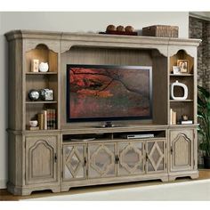 a large entertainment center with a flat screen tv