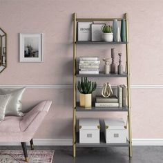 a living room with pink walls and gold shelving unit next to a white chair