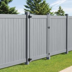 a gray vinyl fence in the grass