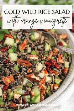 a bowl filled with wild rice salad and garnished with cranberry sauce