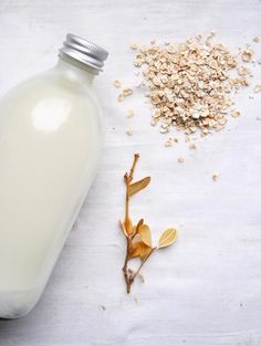 a bottle of milk next to a pile of oatmeal