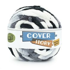 a ball of black and white yarn with the words cover story printed on it's side