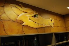 there is a mural on the wall of a library