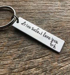 a keychain that says, drive safe love you ask on the front and back