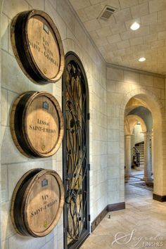 the wine barrel home decor dits is displayed on an iphone screen, and there are three wooden barrels mounted to the wall