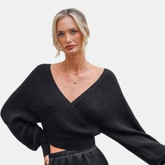 The Black Knit Long Sleeve V-Neck Top brings effortless style with its soft knit fabric and classic v-neckline. Perfect for layering or wearing solo, this top is a must-have for laid-back, everyday looks. Product code: CAA06D4H031AA