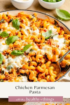 chicken parmesan pasta in a pan with basil leaves on top and the title above it