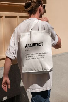 SPECIFICATION: * Tote Bag * 145/220g/m2 * 100% Cotton * Eco Friendly Raw Natural Finish ONE SIZE: * Dimensions: +/- 39x41 cm (15x16 Inches) * Capacity 15 Litres * With Long Handles DESCRIPTION: Introducing our Architect Definition Cotton Tote Bag, a must-have accessory for design enthusiasts and architecture lovers. Made from high-quality cotton, this tote bag combines style and functionality, making it the perfect companion for everyday use. Crafted with care, our tote bag features a captivating print that showcases the definition of an architect. With bold typography and eye-catching graphics, it beautifully captures the essence of this esteemed profession. Carry your belongings in style while proudly displaying your love for architecture. Our spacious tote bag offers ample room to hold Architect Definition, Architect Gift, Gift For Architect, Shopping Games, Funny Definition, Driving Instructor, Funny Tote Bags, Cotton Bags, Reusable Shopping Bags