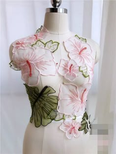 a white dress with pink flowers and green leaves on the back, is for sale at ebay