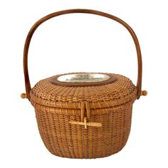 a wicker basket with a wooden handle