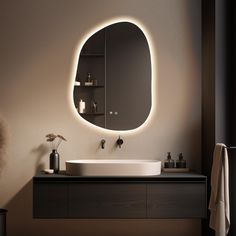 a bathroom with a sink, mirror and lights on the wall above it's counter