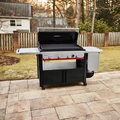 an outdoor bbq grill with the door open