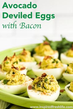 deviled eggs with bacon on a green platter and text overlay that reads, avocado deviled eggs with bacon