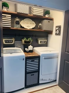 a washer and dryer sitting next to each other in a room with open shelves