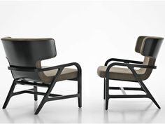 two black chairs with beige upholstered cushions