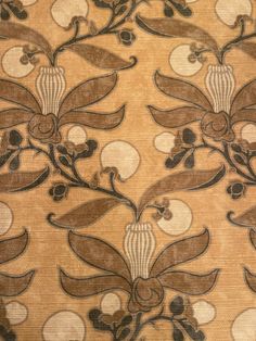 an old wallpaper with flowers and leaves in brown, black and white colors on gold background