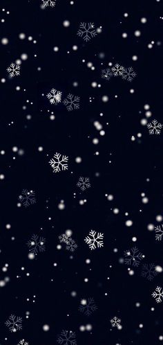 snow flakes are falling down in the night sky