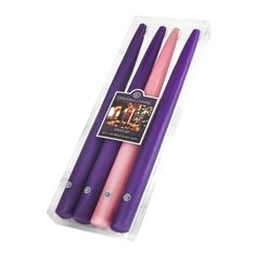 three purple candles in a package on a white background