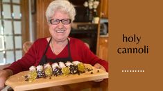 an older woman sitting at a table with a tray of food