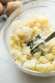 a bowl filled with mashed potatoes and butter