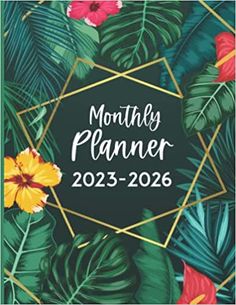 the month planner with tropical leaves and flowers on it, in gold frame against a black background