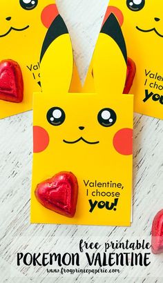 valentine's day cards with pokemon faces and heart shaped candies in front of them