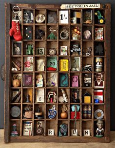 an old wooden box filled with lots of different types of items and numbers on it