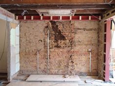 an unfinished room with exposed brick and electrical wires hanging from the ceiling in order to be remodeled