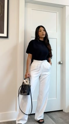 White high waisted linen wide leg pants, chunky dad sandals, oversized structed sweater top, summer hand bag. #minimalist  #elevatedbasics #outfits #outfitstyle #chicstyle #fashion #petitefashion #springoutfits #casualwomensfashion #whattowear #vacationoutfit #linenpants #chunkysandals #summerstyle Minimalistic Style Outfits, Linen Airport Outfit, Dress Pants And Sweater Outfit, Linen Pants Styling, Linen Pants Work Outfit, Linen Wide Leg Pants Outfits, White Linen Pants Outfit Casual, Pant And Top Outfit, Linen Pants Outfit Spring