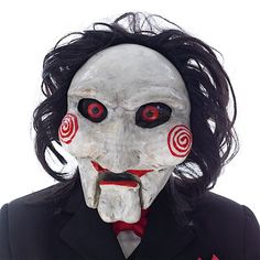 a creepy mask with red eyes and black hair