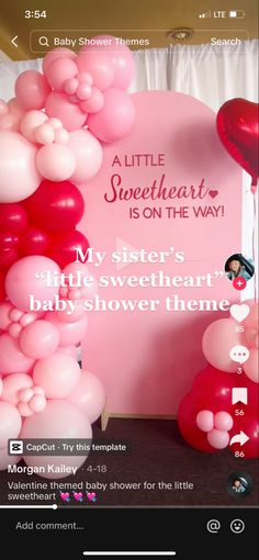 a baby shower theme with balloons and streamers