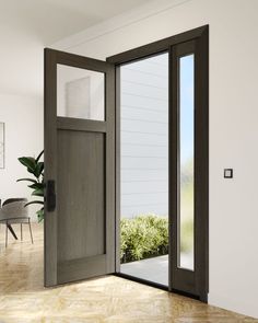 an open door leading to a dining room with a table and chairs in the background