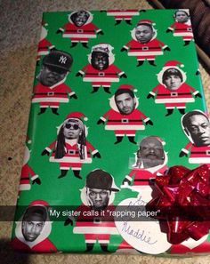 the wrapping paper has been wrapped in red and green with black men's faces on it