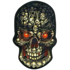 a metal skull with red eyes and skulls on it