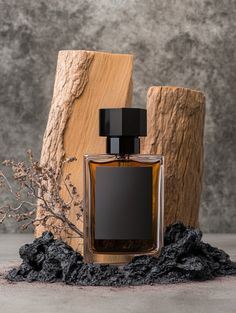 A striking perfume bottle set against a rugged, dark background with natural rock elements, evoking strength and masculinity. Perfect for men's fragrance branding and product photography inspiration. #MensFragrance #PerfumePhotography #MasculineElegance #ProductDisplayIdeas Perfume Photography Creative, Perfume Bottle Display, Fragrance Branding, Male Perfume, Product Photography Inspiration, Perfume Product, Woody Perfume, Fragrance Photography, Luxury Packaging Design