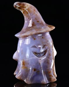 a ceramic head with a hat on it