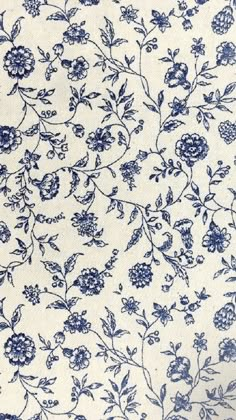 a blue and white floral pattern on fabric