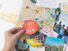 someone is holding up a pin with the word carpe that diem on it