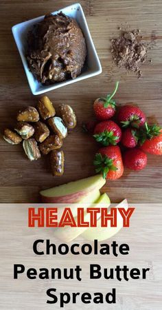 healthy chocolate peanut butter spread with strawberries and apples on the side, along with other ingredients