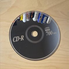 a cd - r disc with various batteries on it