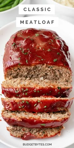 sliced meatloaf on a plate with ketchup